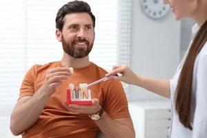patient consulting a dentist about Implant Retained Dentures