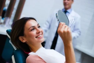 smiling patient after dental cleaning procedure smiling patient after dental cleaning procedure