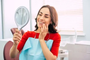 woman smiling happily in the mirror woman smiling happily in the mirror
